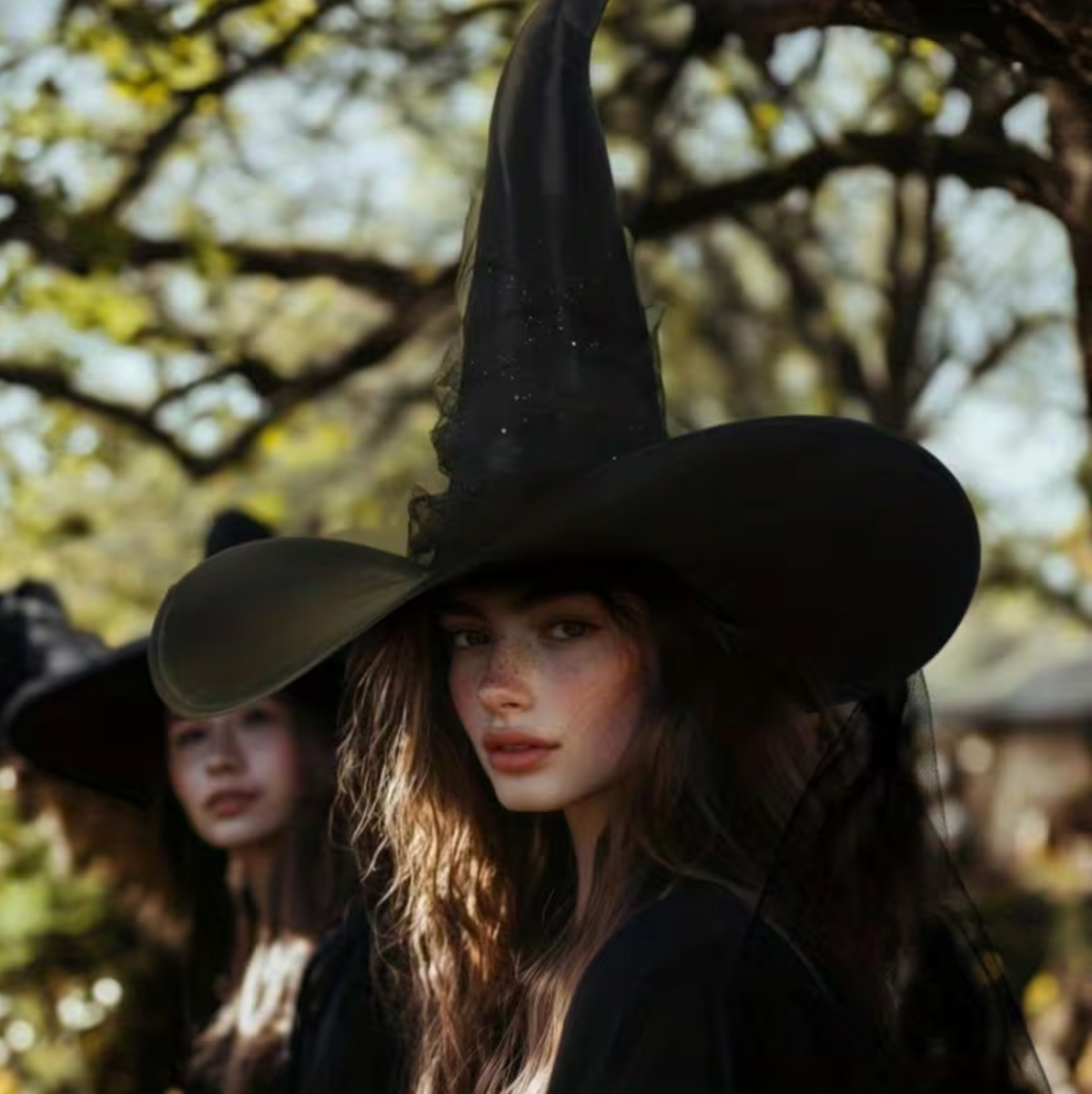 Black Gothic Witch Hat with Wide Brim, Tall Cone, and Hanging Glitter Star Veil