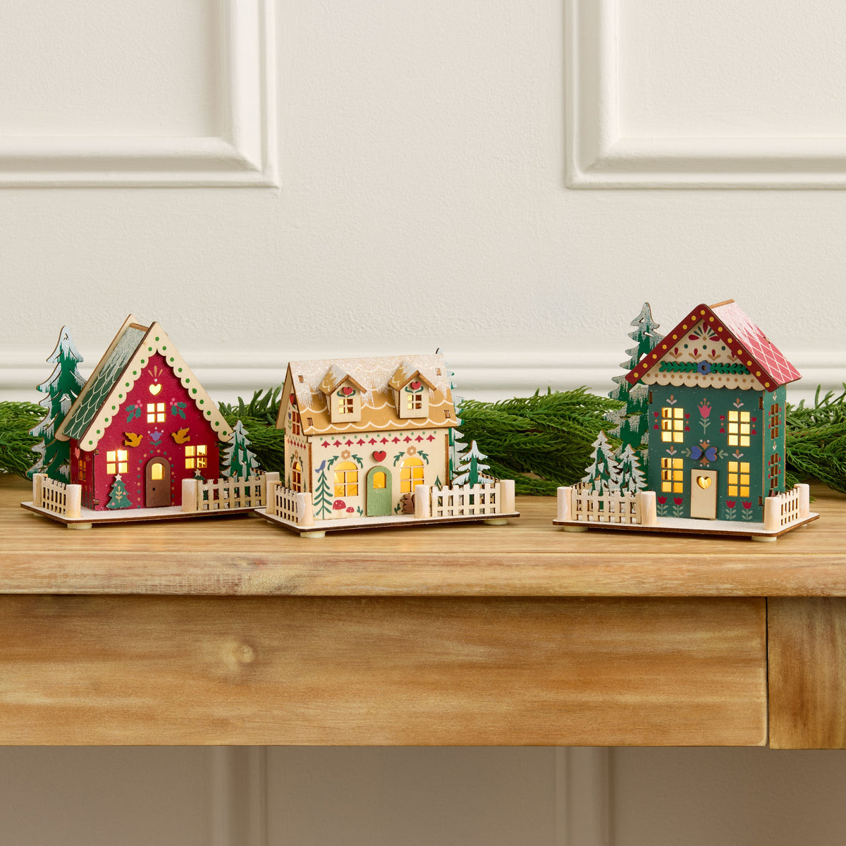 Trio of Wooden Folk Cottages with LED Glow and Timer for Snowy Holiday Displays