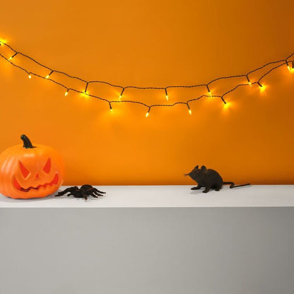 Orange String Lights for Halloween Porches Hedges and Gutter Lines
