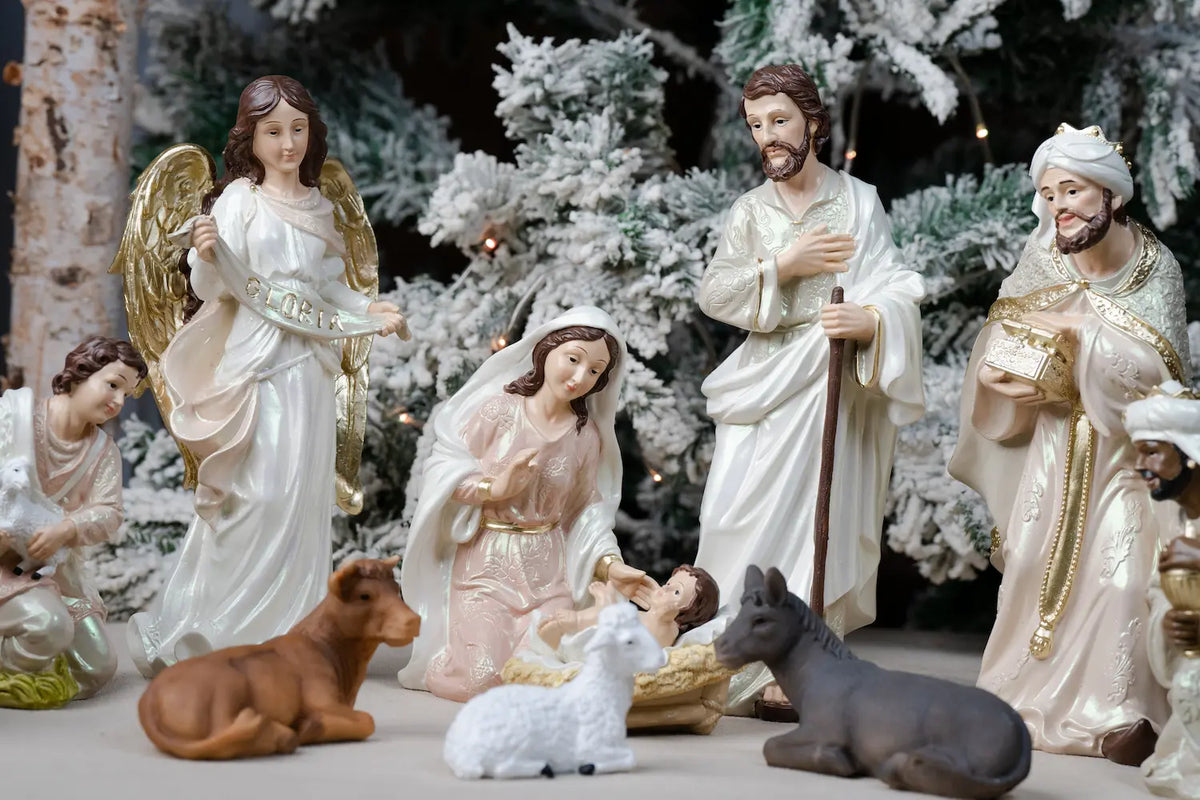 Pearlized Resin Nativity Figures in Blush Pink and Ivory with a Gloria Banner Angel and Straw Manger