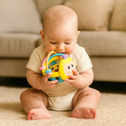 Baby Play Ball with Soft Textured Elements, Movable Rings and Bright Colors in Yellow or Pink