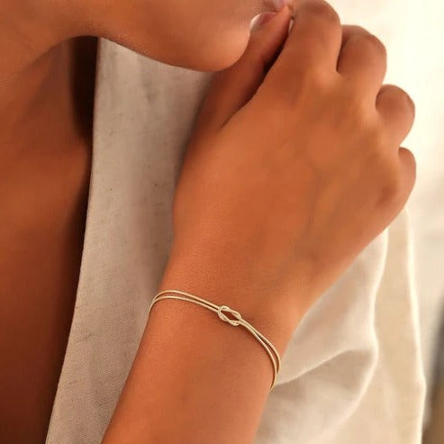 Love Knot Bracelet with an Adjustable Closure and a Lightweight Minimalist Design in Silver, Gold or Rose Gold