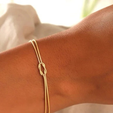 Love Knot Bracelet with an Adjustable Closure and a Lightweight Minimalist Design in Silver, Gold or Rose Gold