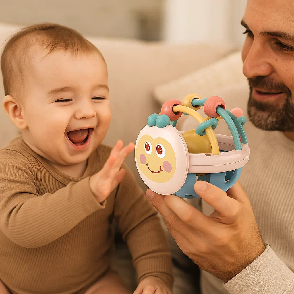 Baby Play Ball with Soft Textured Elements, Movable Rings and Bright Colors in Yellow or Pink