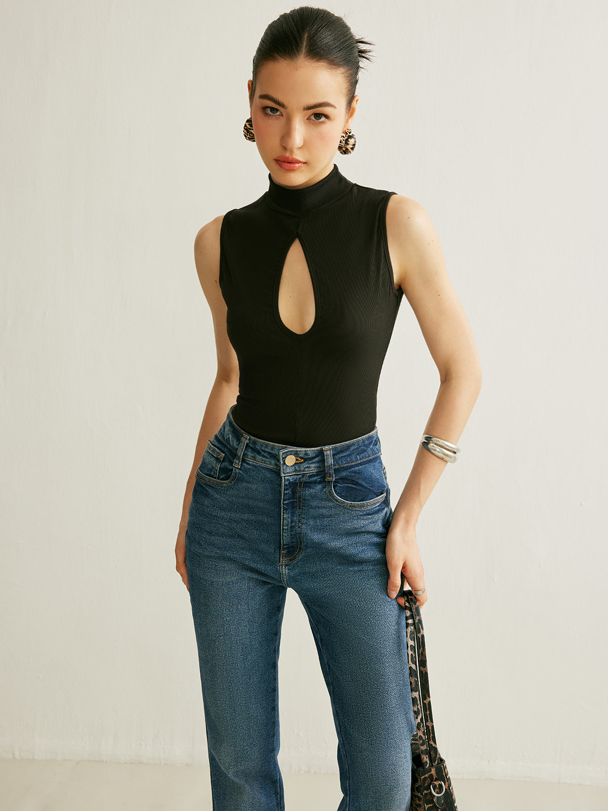 Sleeveless Ribbed Mock Neck Top with a Keyhole in 90 Percent Polyester and 10 Percent Elastane