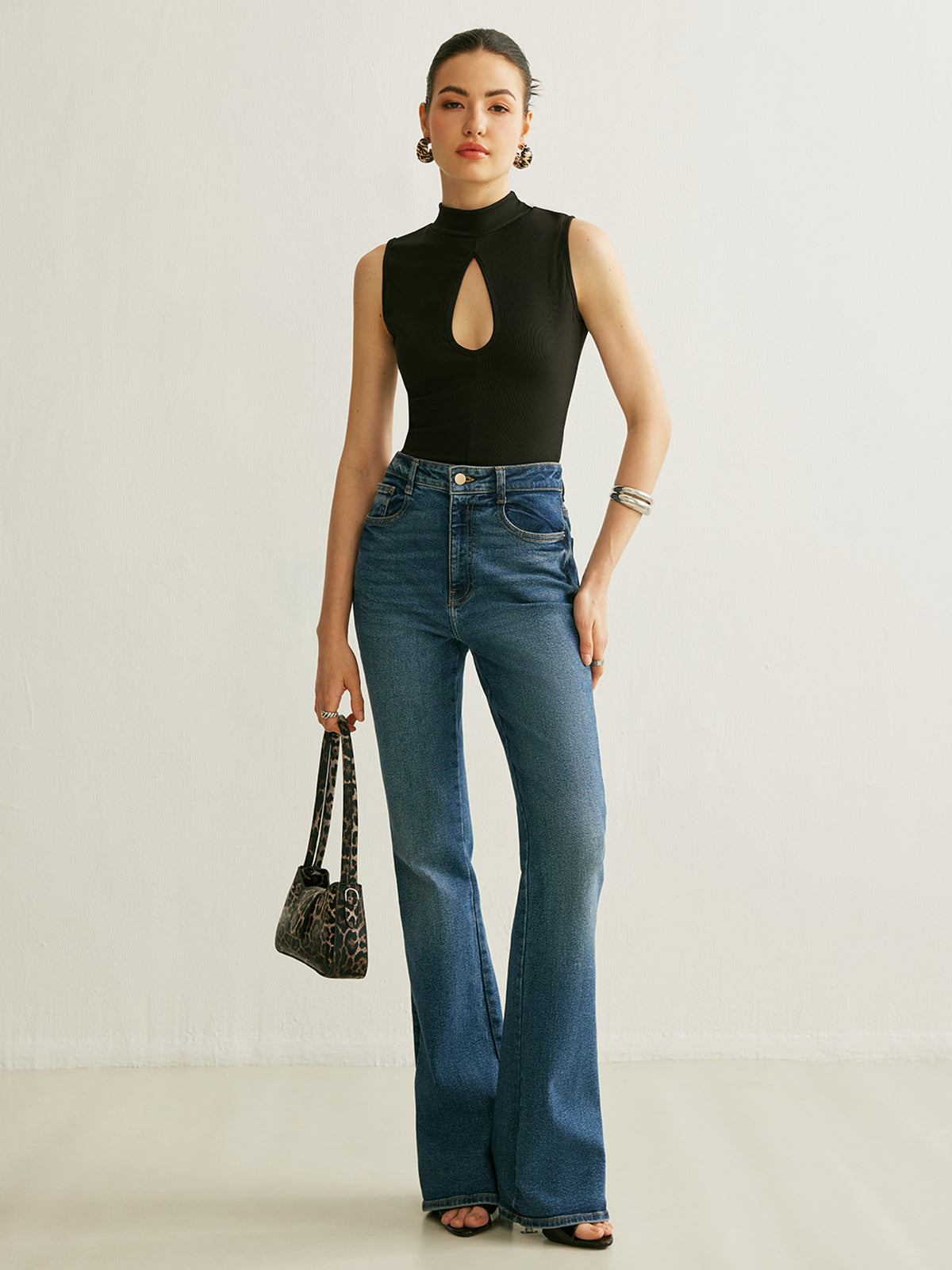 Sleeveless Ribbed Mock Neck Top with a Keyhole in 90 Percent Polyester and 10 Percent Elastane