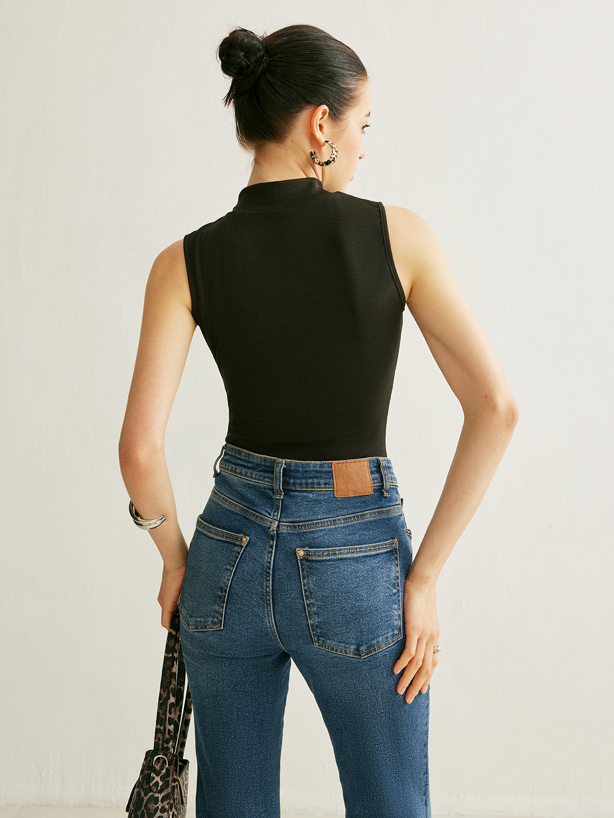 Sleeveless Ribbed Mock Neck Top with a Keyhole in 90 Percent Polyester and 10 Percent Elastane