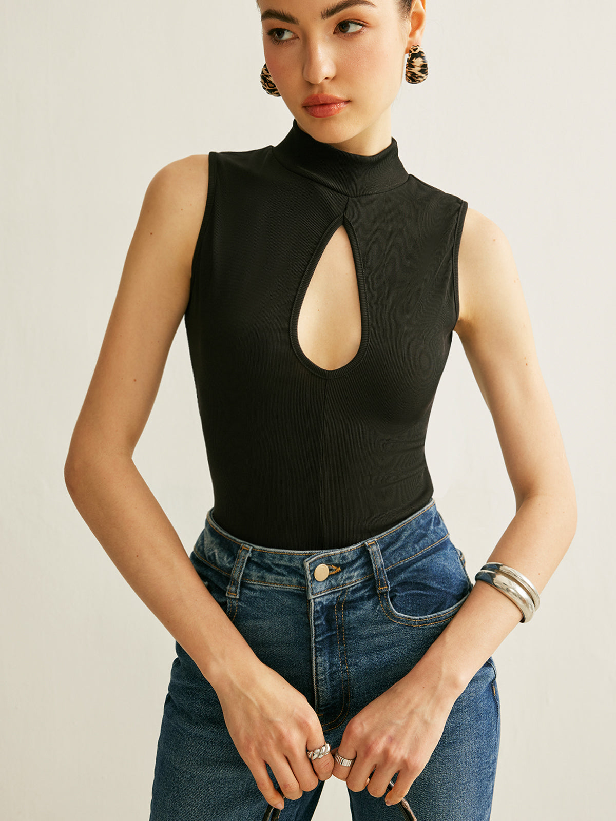Sleeveless Ribbed Mock Neck Top with a Keyhole in 90 Percent Polyester and 10 Percent Elastane